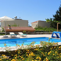 02 Giorgos pool terrace and colourful flowerbeds