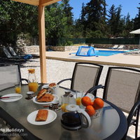 10 Giorgos poolside covered dining area