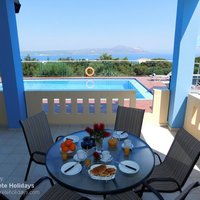 11 Maria covered dining terrace with pool and sea view